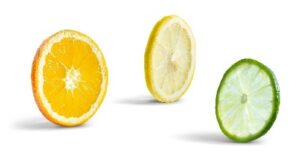 orange lemon and lime slices on white background